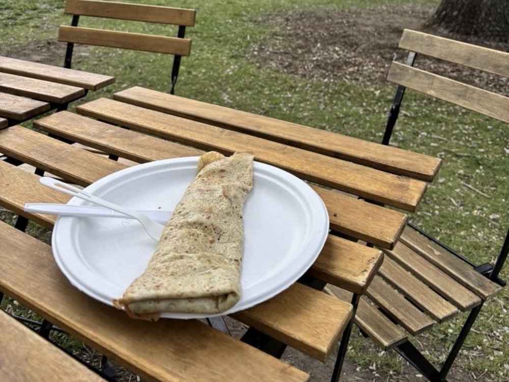A folded Olivier's crêpe on a plate at Idlewild Park